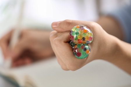 Woman squeezing colorful slime, closeup. antistress toy