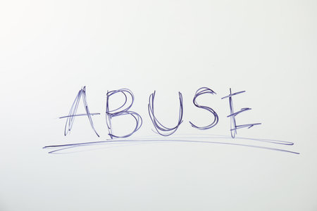 Word ABUSE on white background. domestic violence awarenessの写真素材