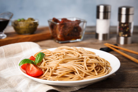 Tasty buckwheat noodles served on wooden tableの写真素材