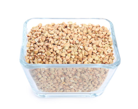 Green buckwheat in bowl isolated on whiteの写真素材