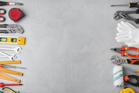 Flat lay composition with construction tools on light gray background. Space for textの写真素材