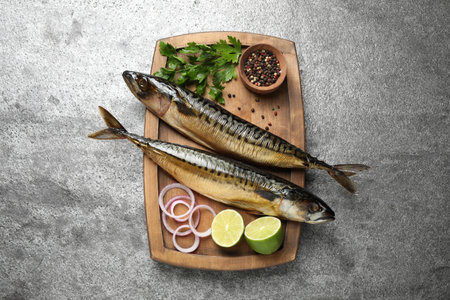 Tasty smoked fish on gray table, top viewの写真素材