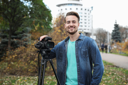 Video operator with camera working in park