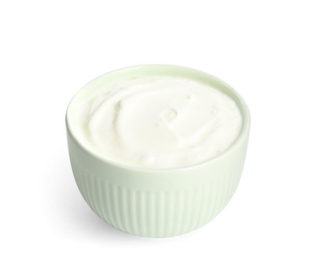 Tasty organic yogurt in bowl isolated on whiteの写真素材