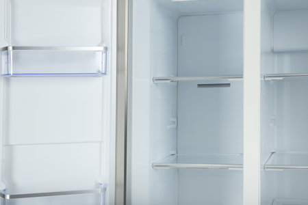 Shelves of empty modern refrigerator, closeup viewの写真素材