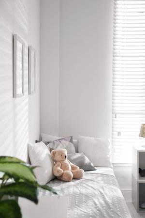 Modern child room interior with comfortable bedの写真素材