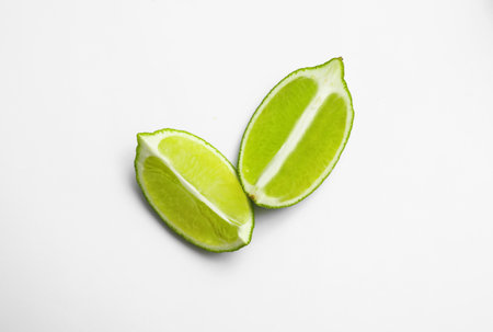 Cut fresh juicy lime on white background, top viewの写真素材