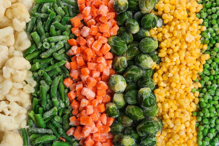 Various frozen vegetables as background, top view