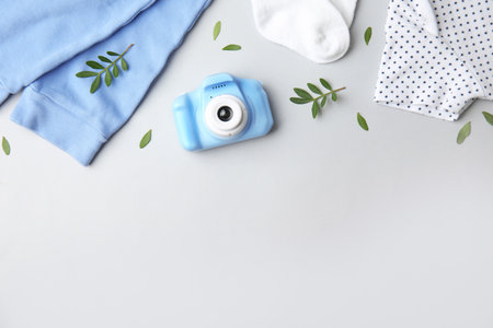 Flat lay composition with toy camera on light gray background, space for text. future photographerの写真素材