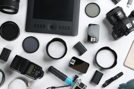 Flat lay composition with equipment for professional photographer on white backgroundの写真素材