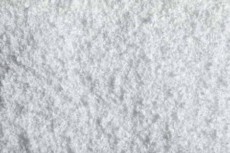 Pile of white snow as background, top view