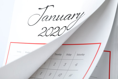 January 2020 calendar with turning pages as background, closeup