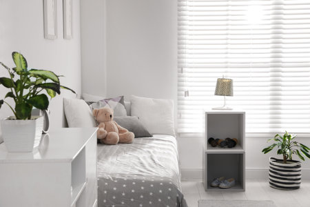 Modern child room interior with comfortable bedの写真素材