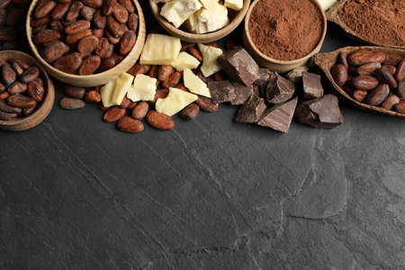 Flat lay composition with organic cocoa butter on black table. Space for textの写真素材