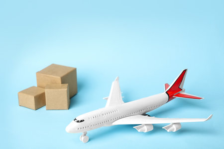 Toy plane on blue background. Logistics and wholesale conceptの写真素材