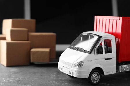 Toy truck on table. Logistics and wholesale conceptの写真素材