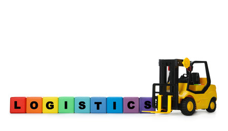 Toy forklift and cubes with word LOGISTICS isolated on white. wholesale conceptの写真素材