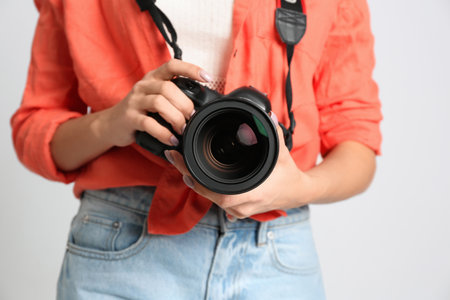 Professional photographer working on white background in studio, closeupの写真素材