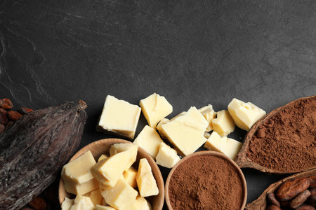 Flat lay composition with organic cocoa butter on black table. Space for textの写真素材