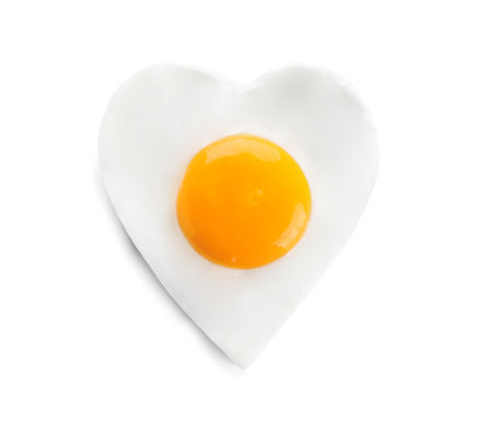Heart shaped fried egg isolated on white, top viewの写真素材