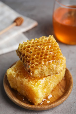 Fresh delicious honeycombs on gray table, closeupの写真素材