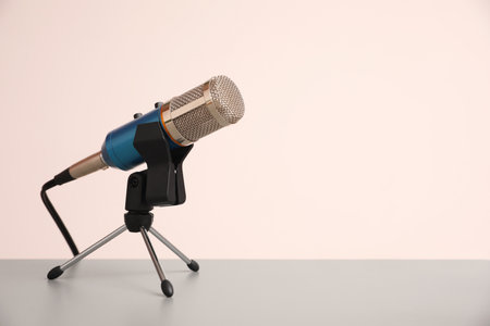 Microphone on light gray table, space for text. Journalist's workの写真素材