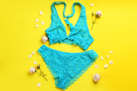 Flat lay composition with sexy women's underwear on yellow backgroundの写真素材