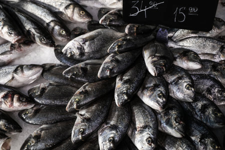 Fresh raw fish on ice in supermarket, closeupの写真素材