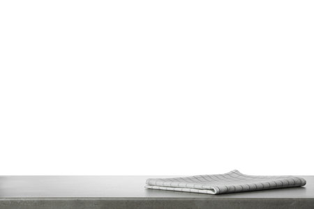 Folded kitchen towel on gray table. space for designの写真素材