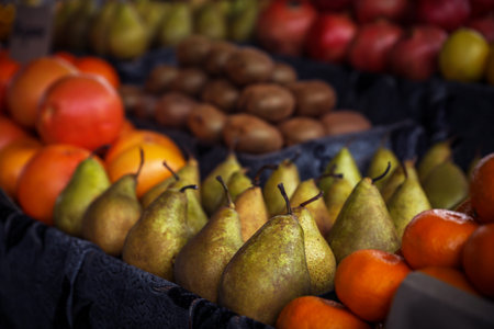 Tasty fresh fruits on counter at wholesale market, closeupの写真素材