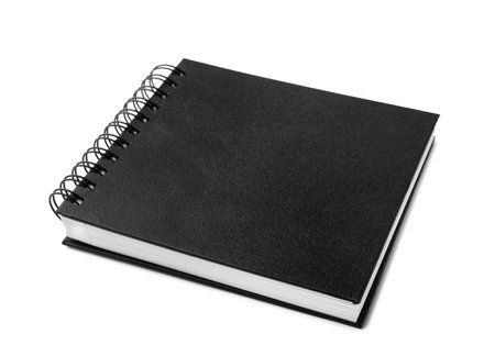 Stylish black spiral notebook isolated on whiteの写真素材