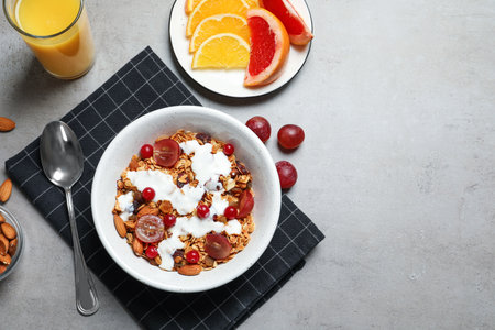 Tasty healthy breakfast served on gray table, flat lay. Space for textの写真素材
