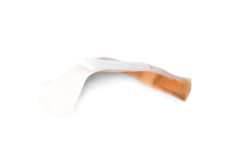 Used sticking plaster isolated on white, top view. First aid itemの写真素材
