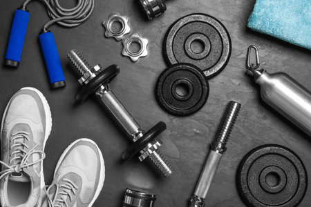 Gym equipment on black background, flat layの写真素材