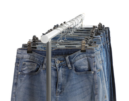 Rack with different jeans isolated on whiteの写真素材