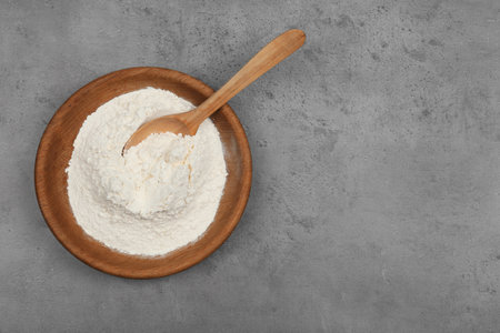 Flour on light gray background, top view. Space for textの写真素材