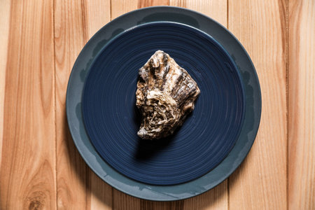 Fresh oyster on wooden table, top viewの写真素材
