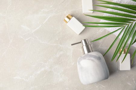 Flat lay composition with soap dispenser on marble background. Space for textの写真素材
