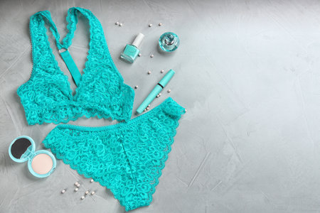 Flat lay composition with women's underwear on light gray background, space for textの写真素材
