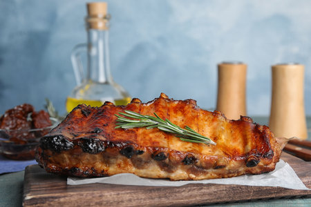 Tasty grilled ribs with rosemary on tableの写真素材