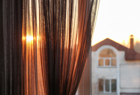 Window with beautiful transparent curtain, closeup viewの写真素材