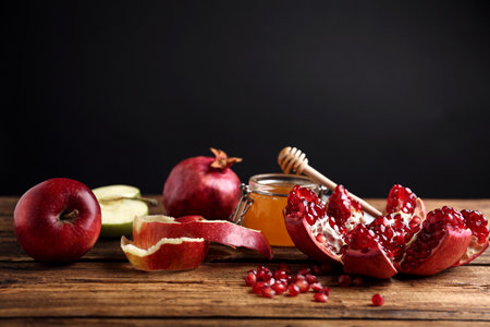 Honey, apples and pomegranate on wooden table. Rosh Hashanah holidayの写真素材
