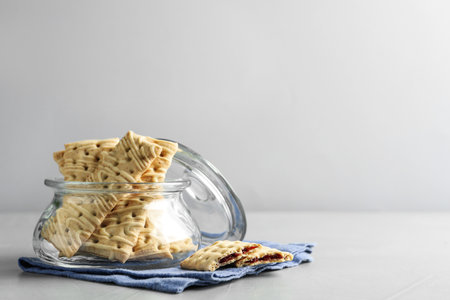 Tasty cookies with filling on light gray table. Space for textの写真素材