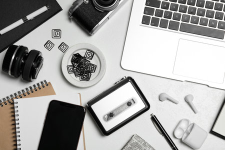 Flat lay composition with equipment for journalist on white tableの写真素材