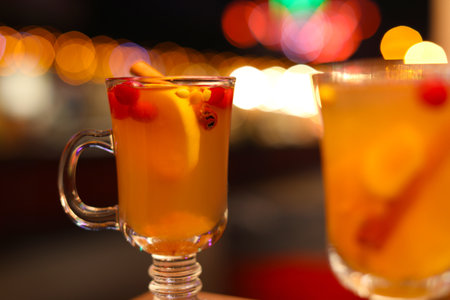Tasty aromatic mulled wine on blurred backgroundの写真素材