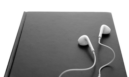 Bible and earphones on white background, closeup. religious audiobookの写真素材