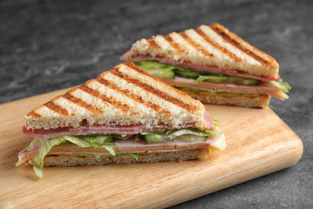 Tasty sandwich with ham on gray table, closeupの写真素材