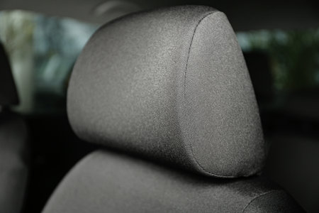 Car seat with gray upholstery, closeup view