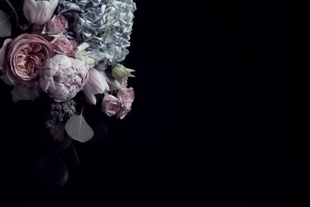 Beautiful bouquet of different flowers on black background, space for text. Floral card design with dark vintage effectの写真素材