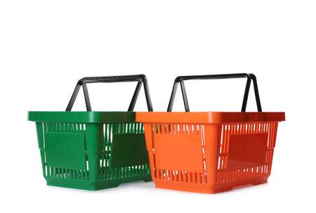 Color plastic shopping baskets isolated on whiteの写真素材